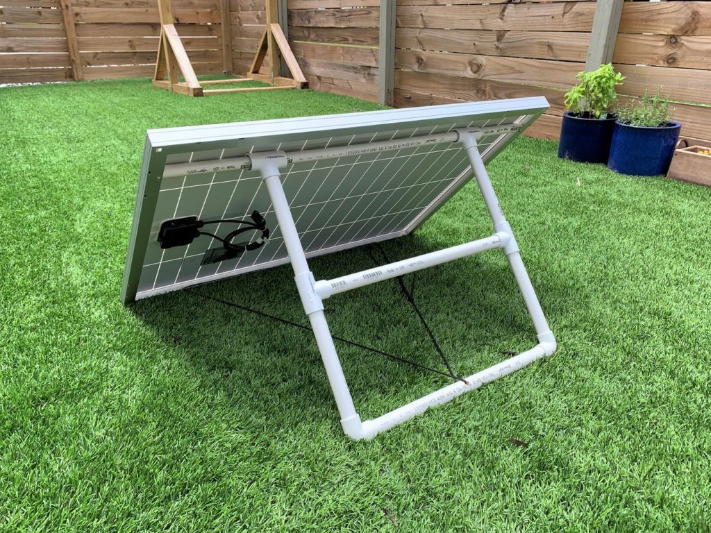 A solar panel mounted in a yard