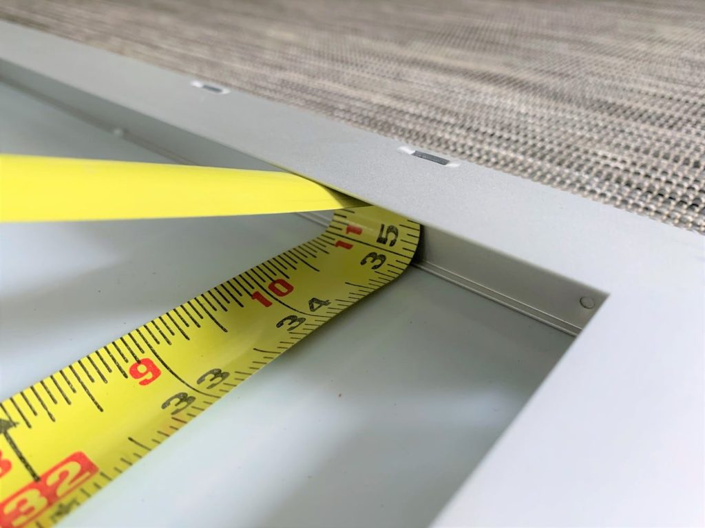 A close up of a tape measure showing 35 inches in length