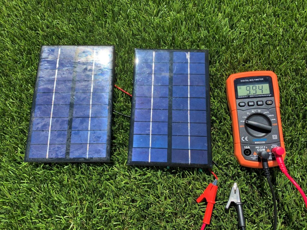 Testing the voltage of two solar panels wired in parallel with a digital multimeter