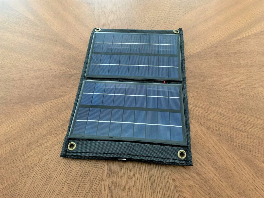A completed DIY solar USB charger resting on a table